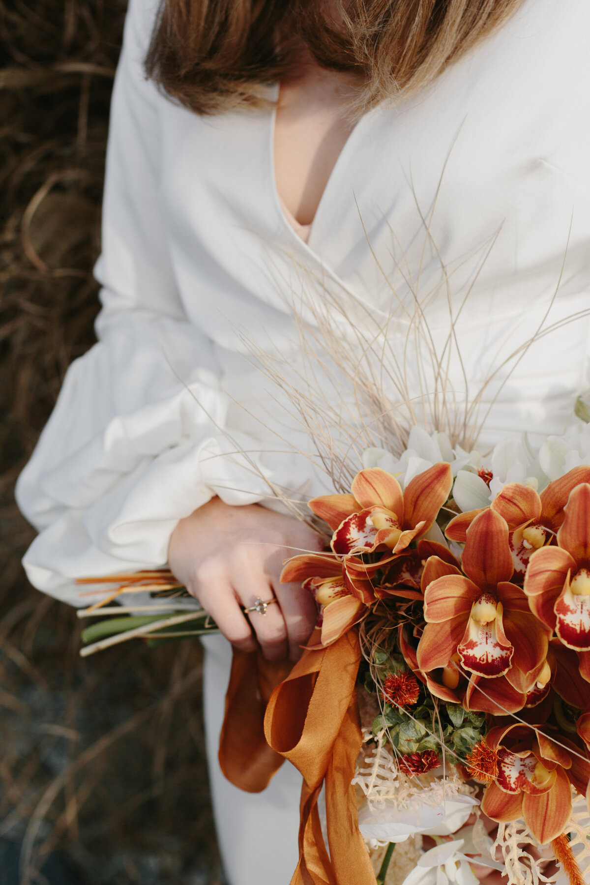 The Lovers Elopement Co - bride holds flower bouquet designed by The Lovers Elopement