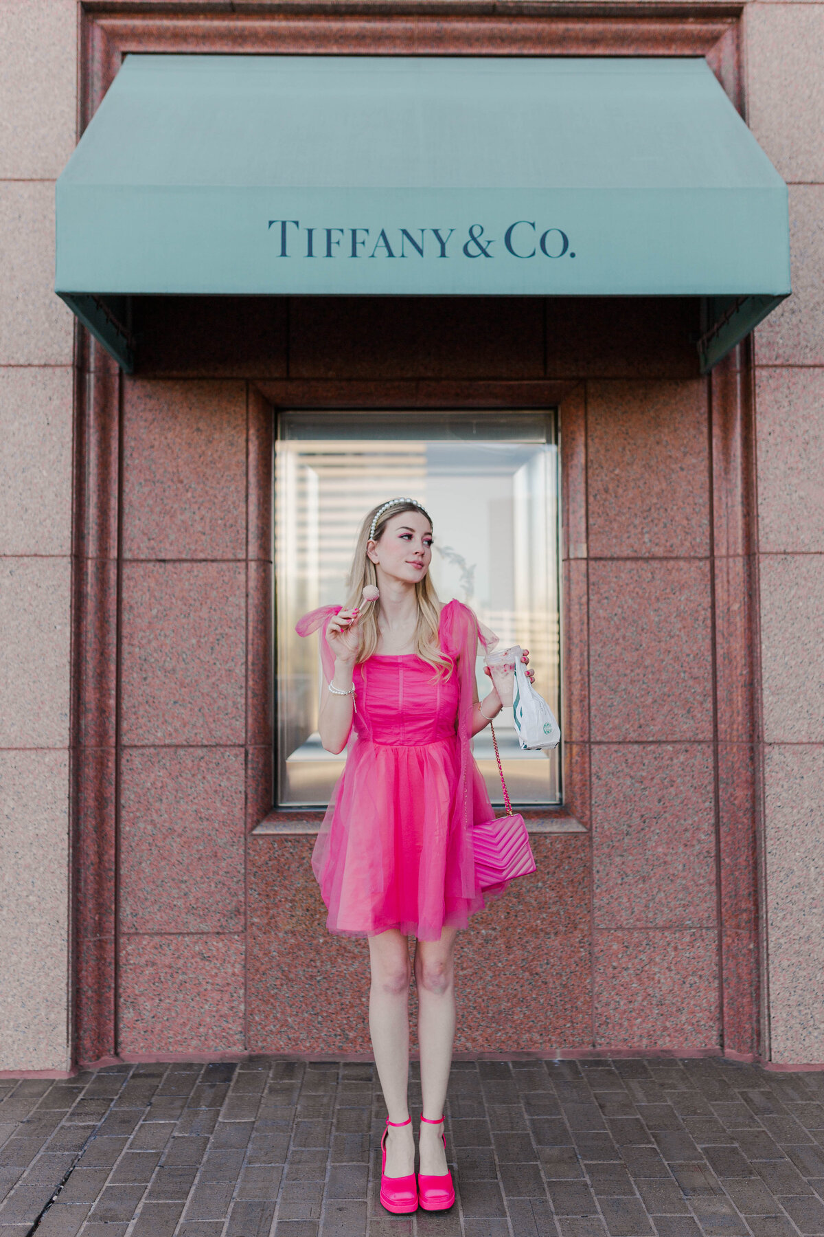 Breakfast at tiffany's barbie model poses in front of tiffany's at the houston galleria