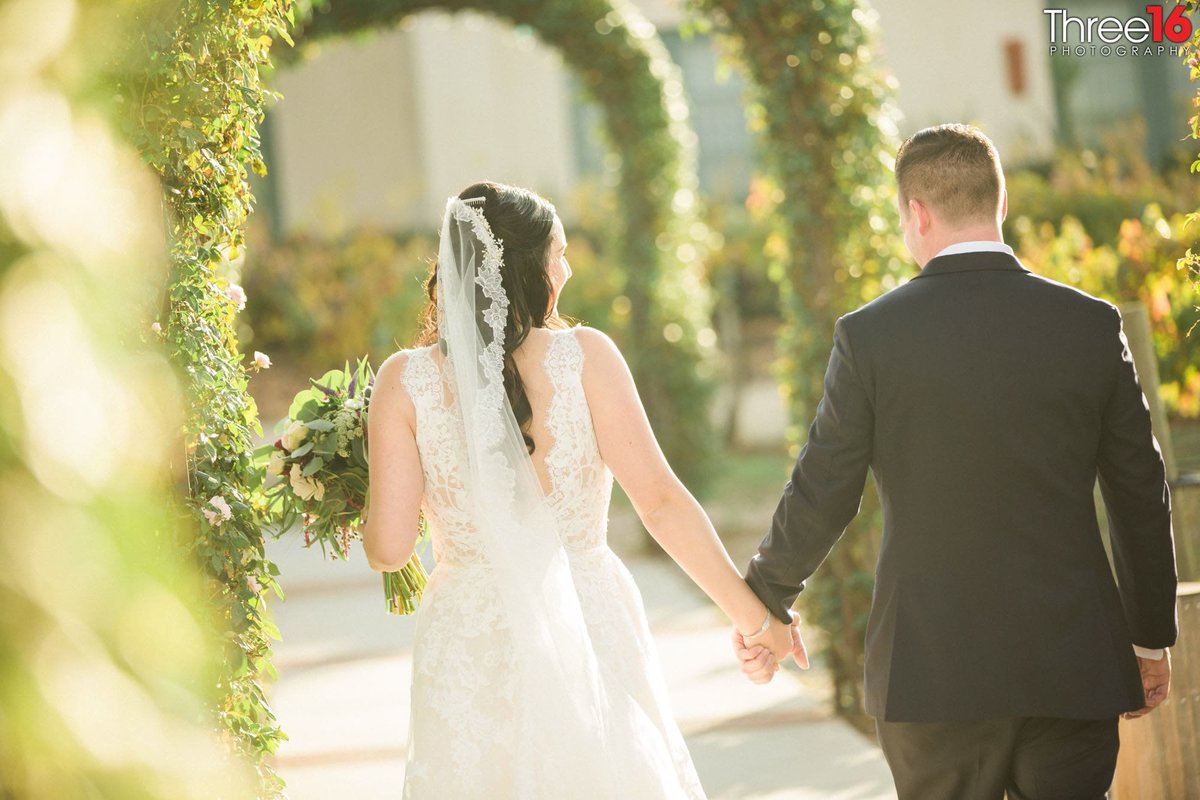 Bride and Groom walking hand in hand