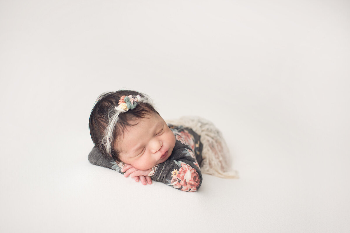 tampa newborn session of baby girl with white backdrop