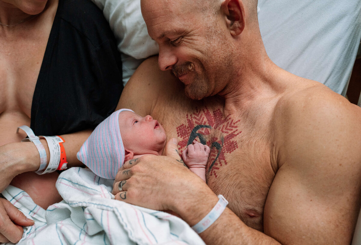 eye-contact-with-newborn-and-dad-