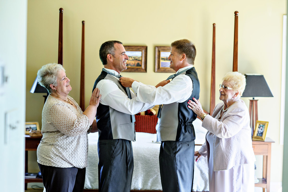 Mothers helping their sons get ready for their same sex wedding in bucks county.