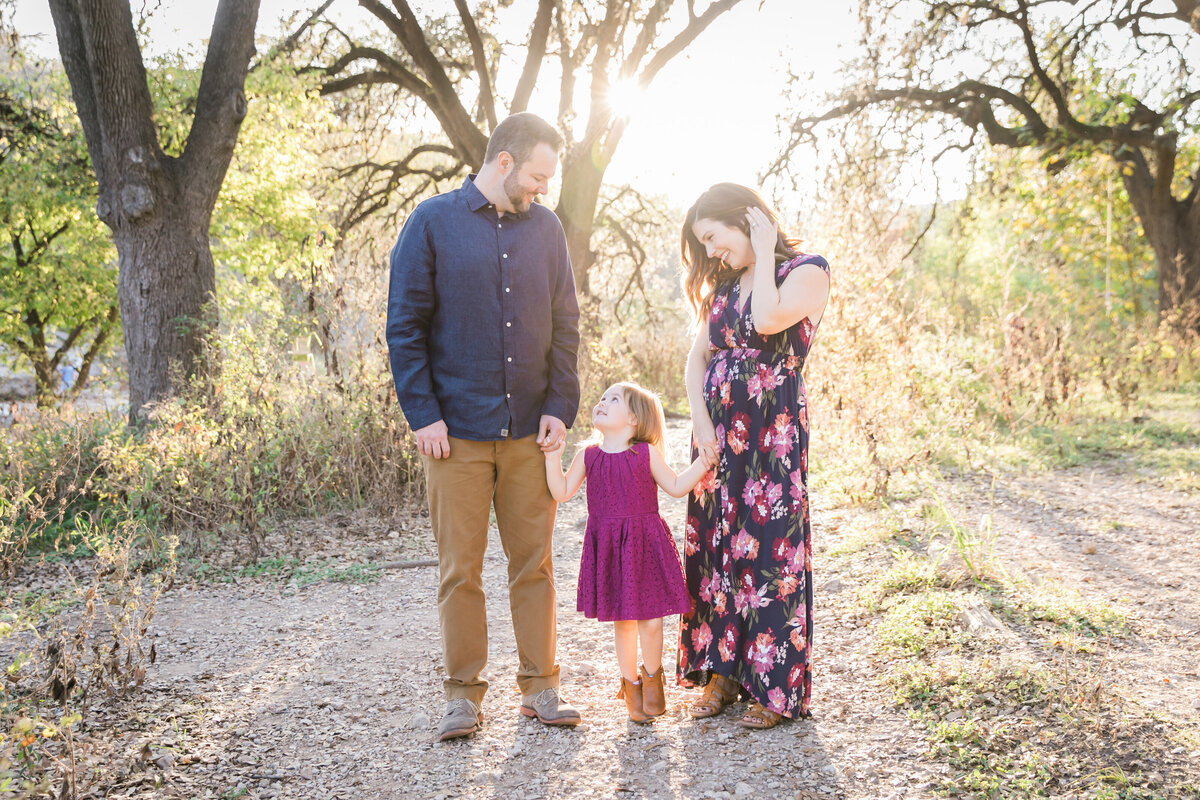 Family posing with sun and trees behind them, Austin Family Photographer, Tiffany Chapman Photography
