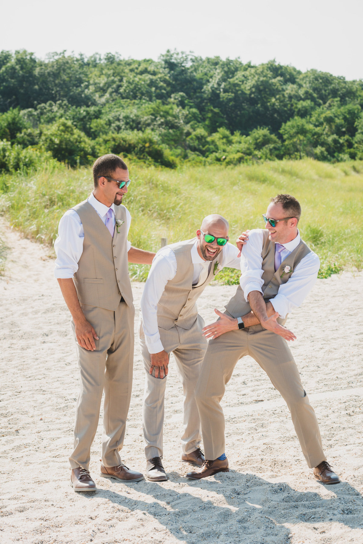 photo of groom with groomsmen on the beach from wedding at Pavilion at Sunken Meadow