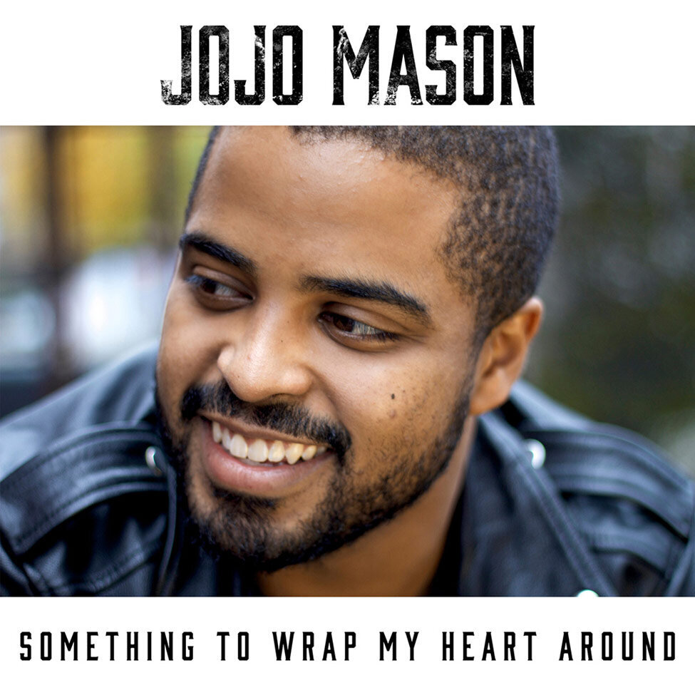 CD Single Cover Title Something To Wrap My Heart Around Artist JoJo Mason closeup smiling looking away from camera background out of focus behind him