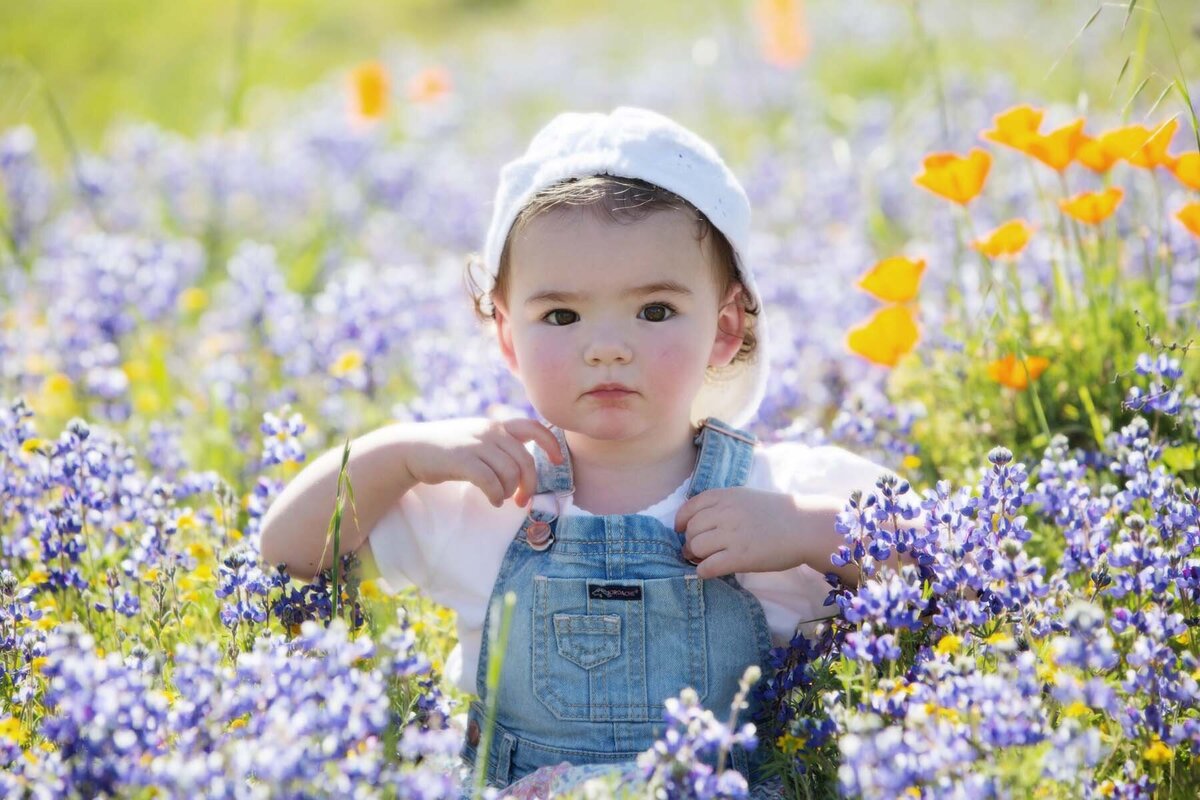baby girl in flower field