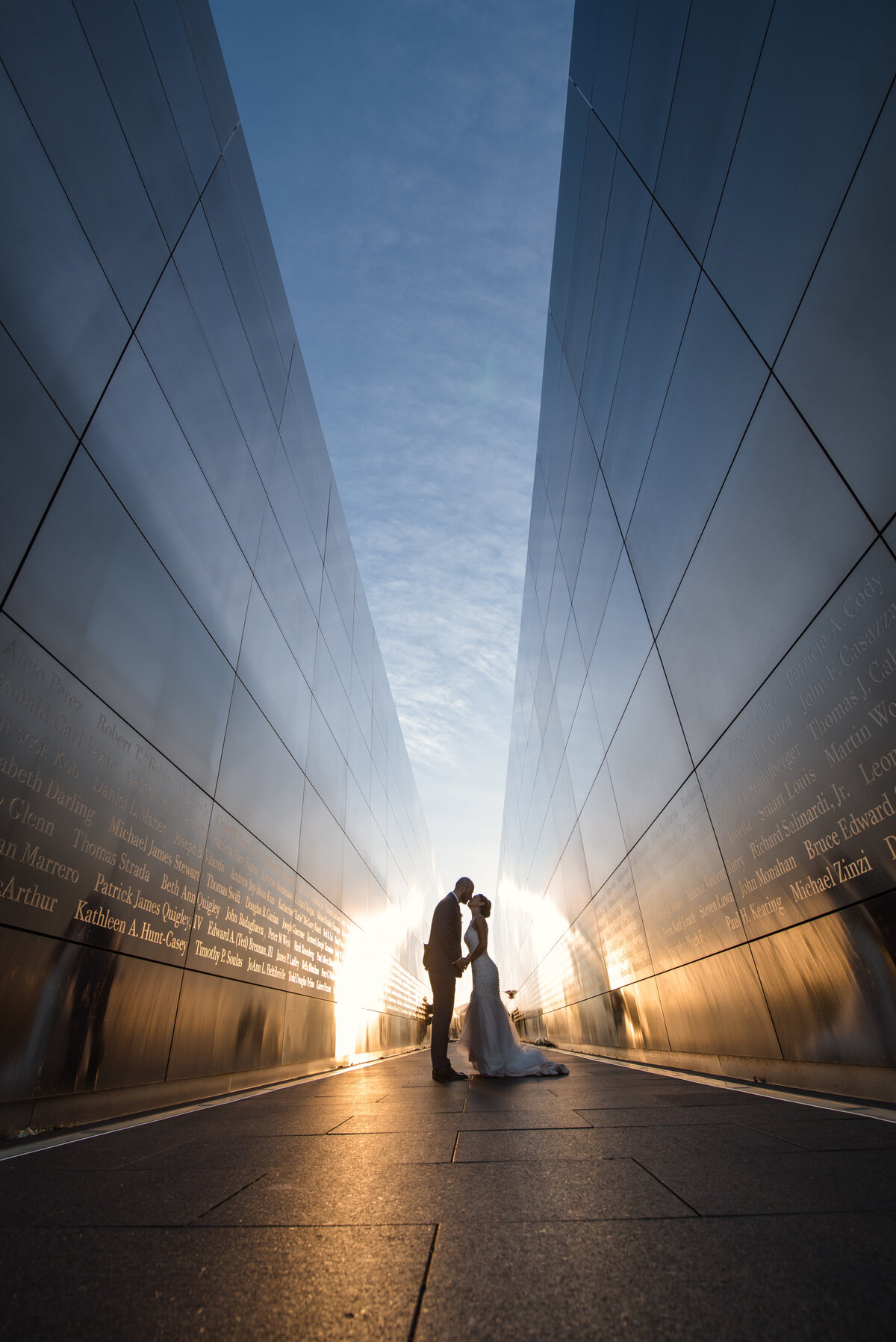 bride and groom standing between two buildings at Maritime Parc