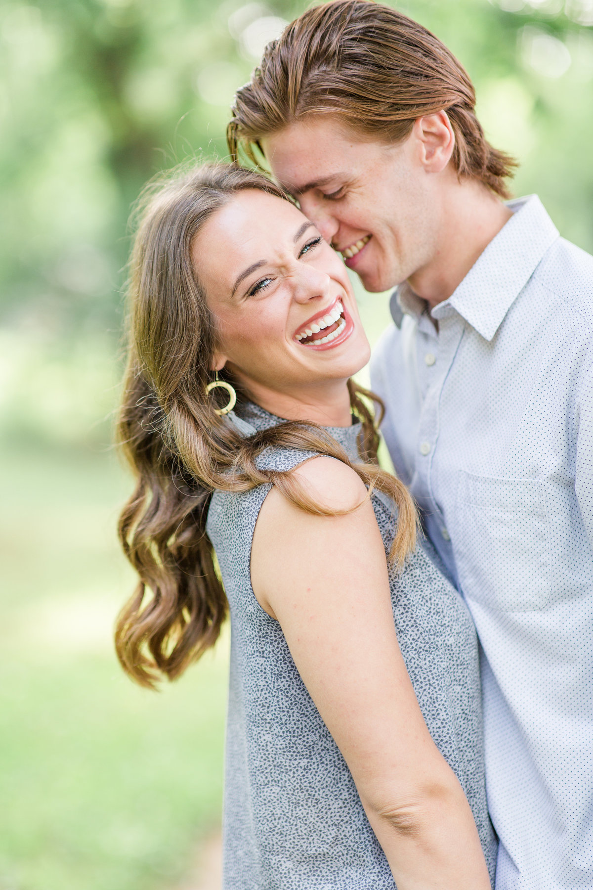 Engagement photo of couple laughing