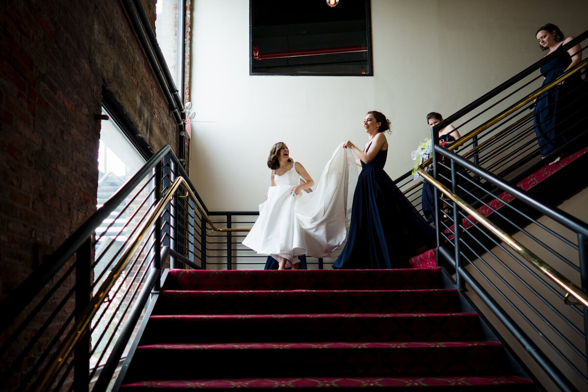 bride-staircase-dress-holding