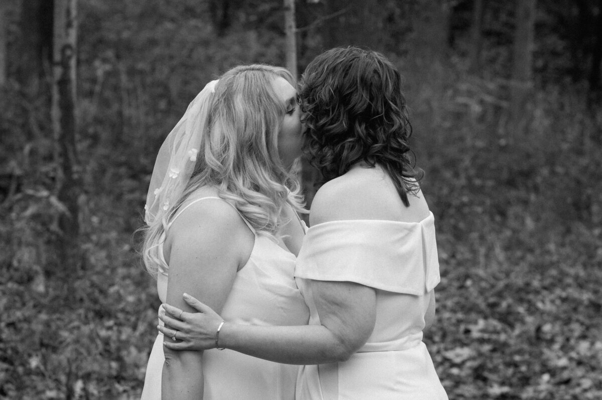 two brides kiss