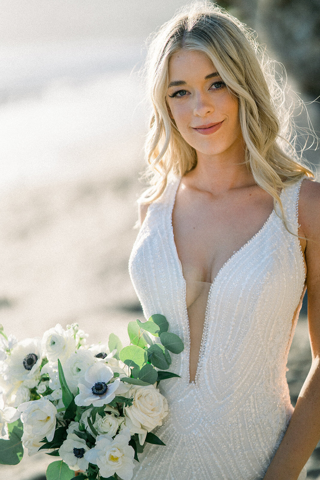 Bride on the beach at Dolphin Bay Resort in Pismo Beach, CA