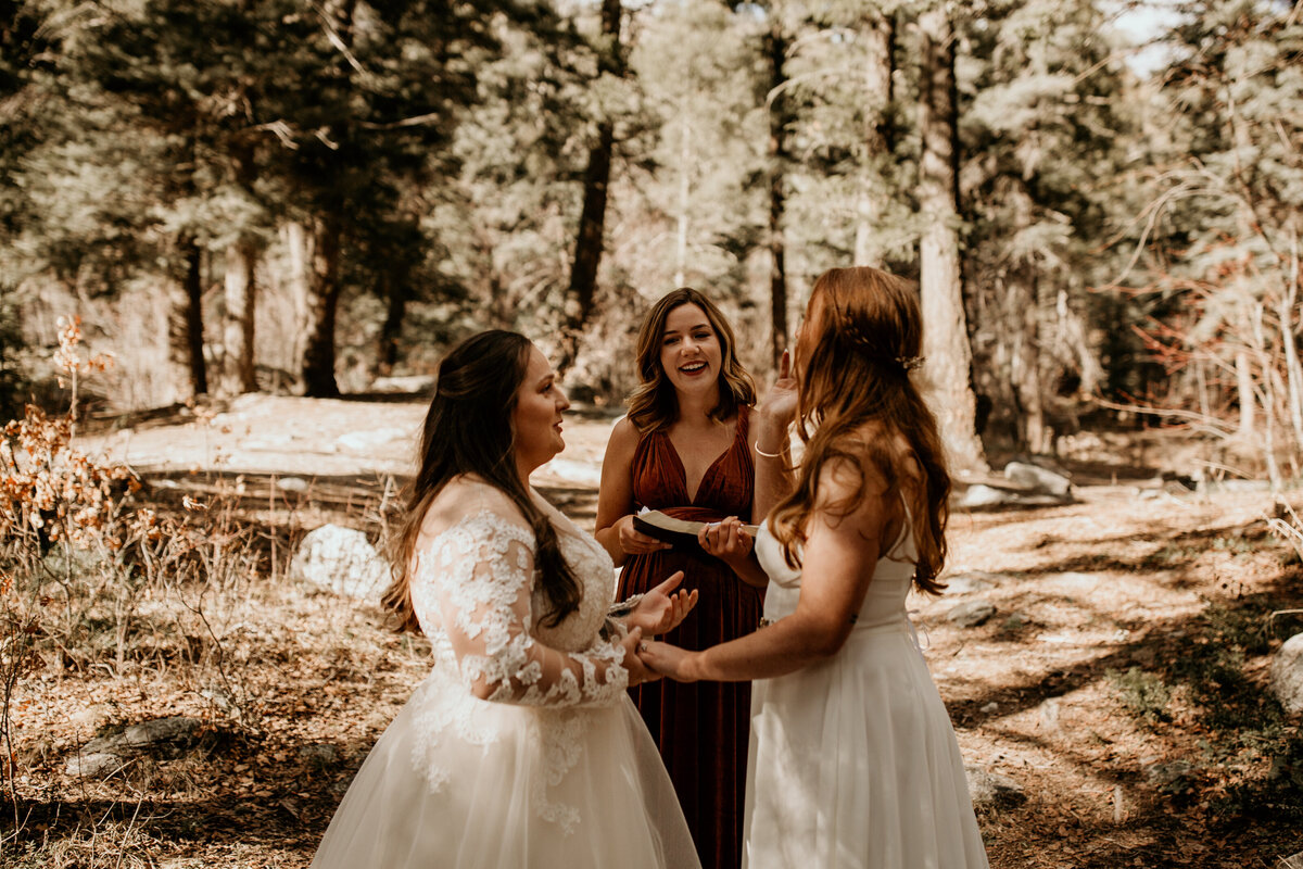 same sex couple saying vows in Taos New Mexico