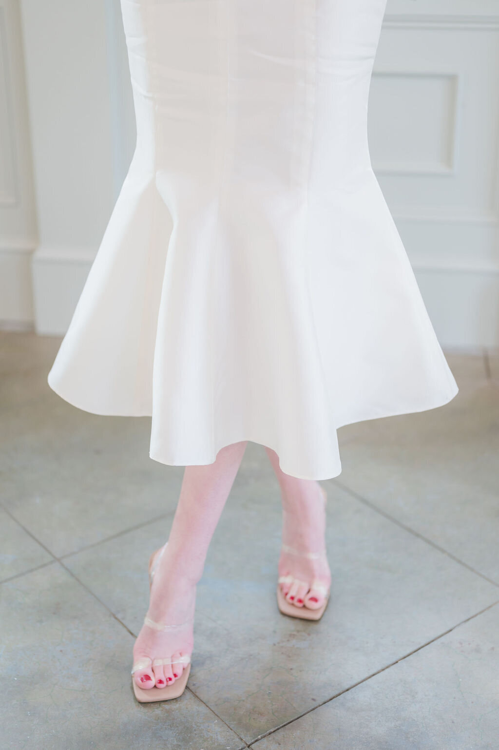 The Lana bridal style is a mikado wedding dress in a midi-length fit-and-flare silhouette by indie designer Edith Elan.