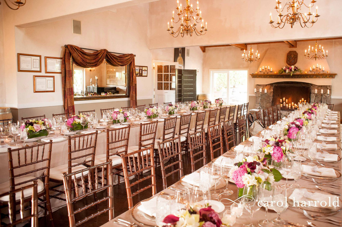 long dinner party tables lined with flower centerpieces at Chateau Lill