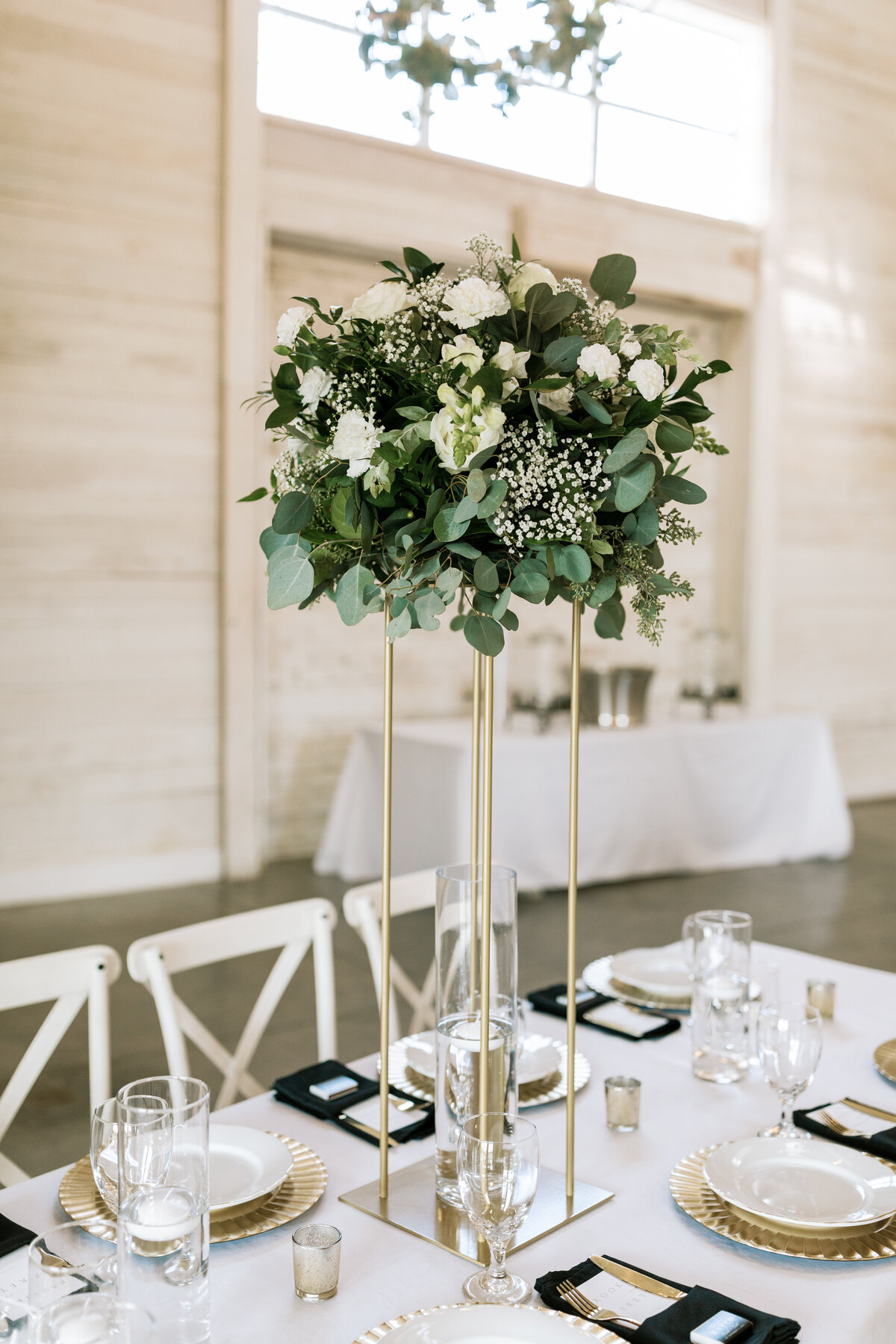 High centerpiece on table at White Dove Barn