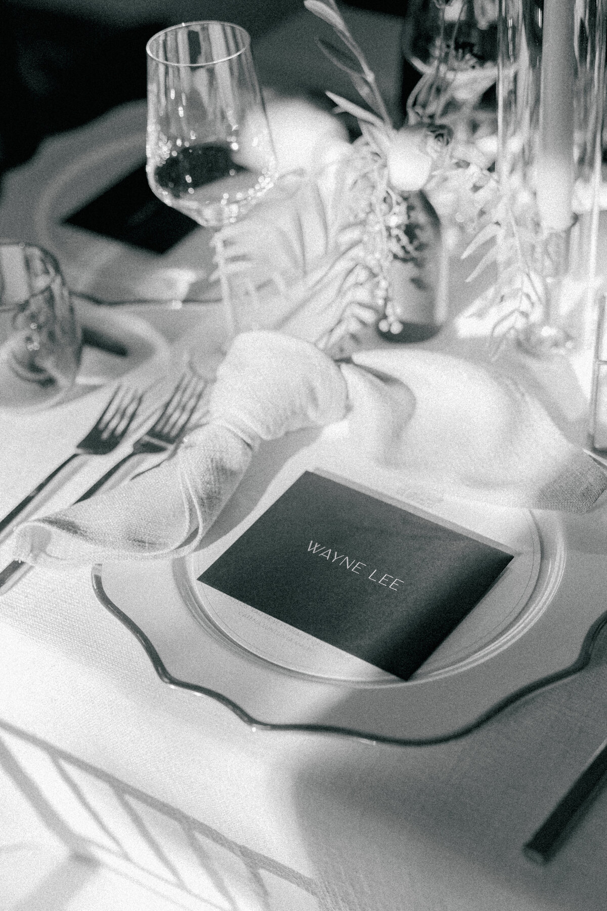 Black and white photographer based in Charleston, SC. Sunshine hitting intentional table at small guest count fall wedding at the Post House Inn. Charleston destination wedding.