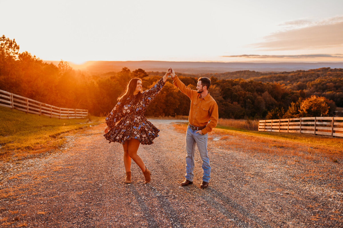 photo of woman twirling with her fiance