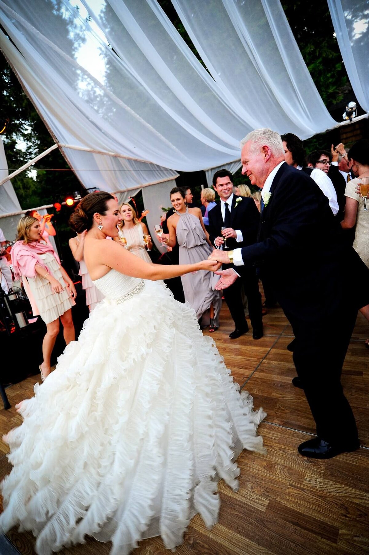 bride dancing with grandfather during wedding reception