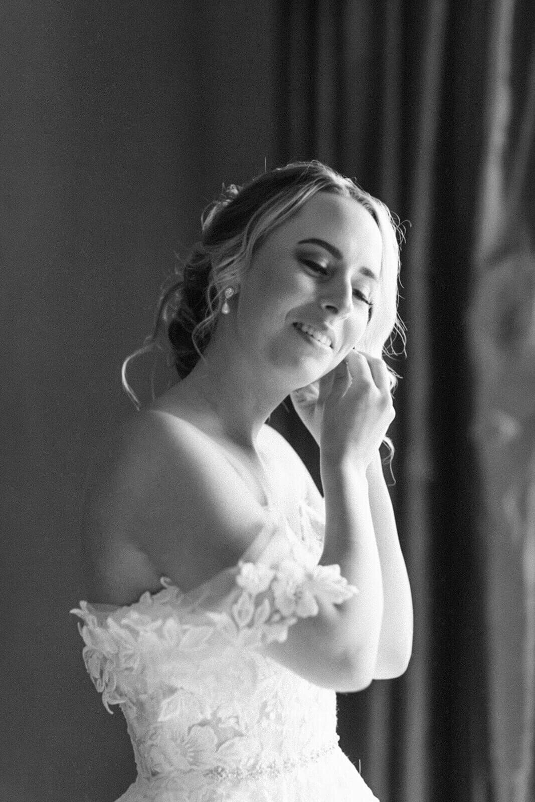 bride-puts-on-earings-Alyssa-Marie-Photography-wedding-day-Cape-Breton