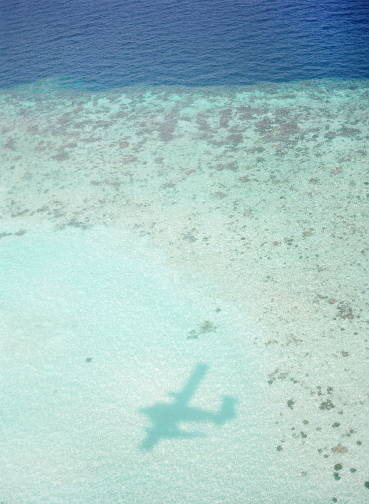 8-KTMerry-airplane-shadow-destinationwedding-Maldives