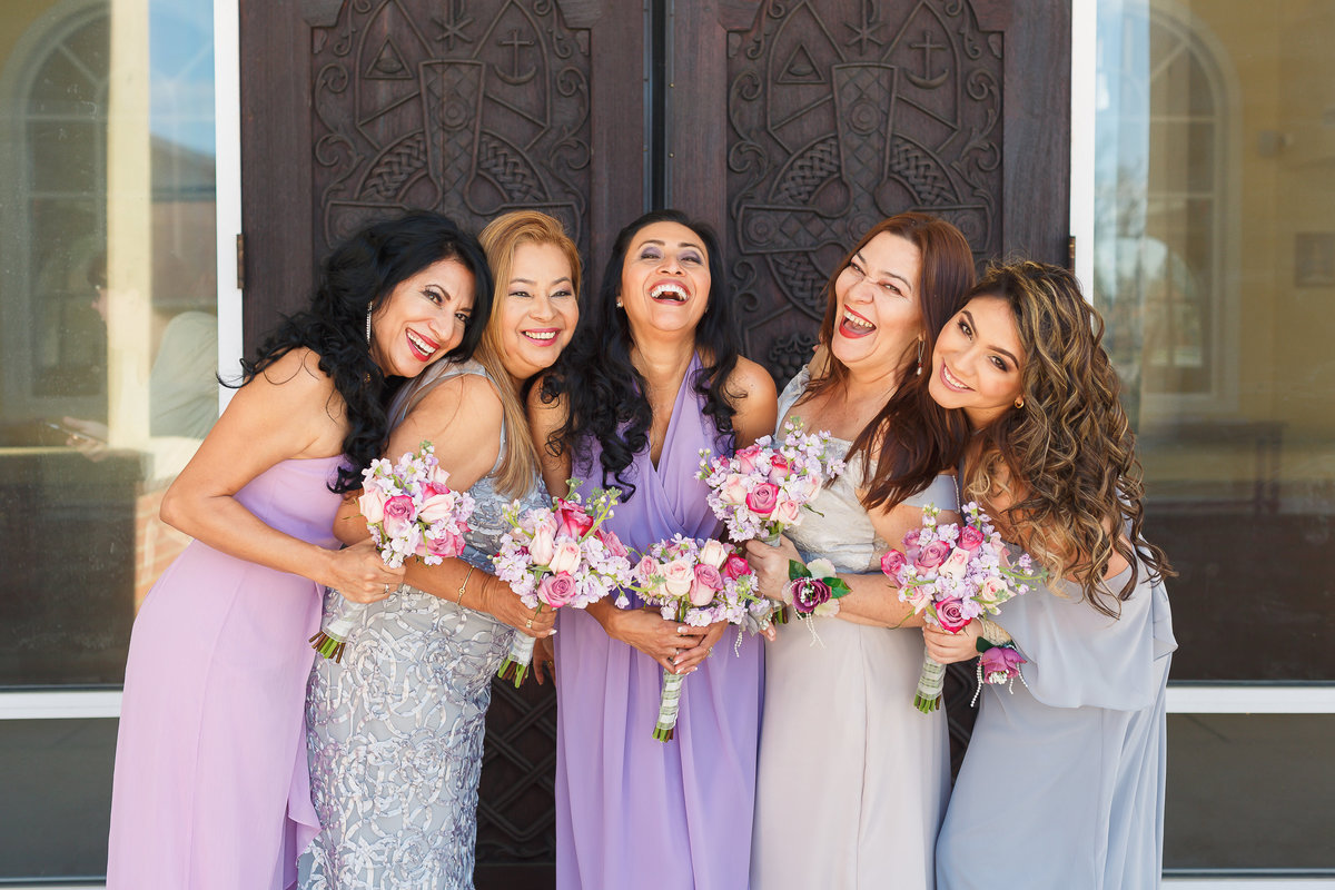Smiling and Laughing Bridesmaids Pose in Lavender Dresses Outside of St Lukes Wedding in Jacksonville Florida