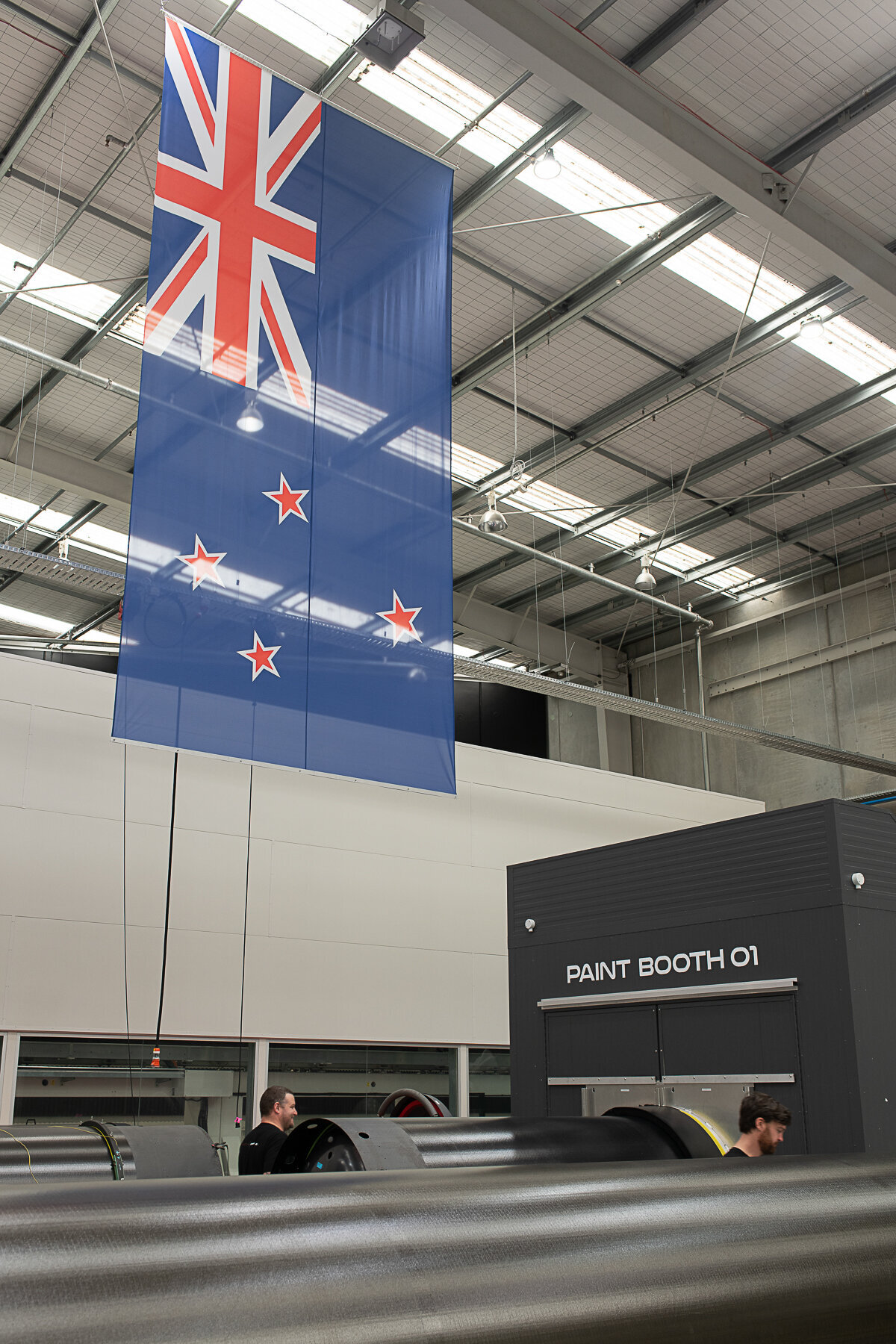 Rocket lab's Auckland Production Centre. Internal image with large NZ Flag hung from roof.