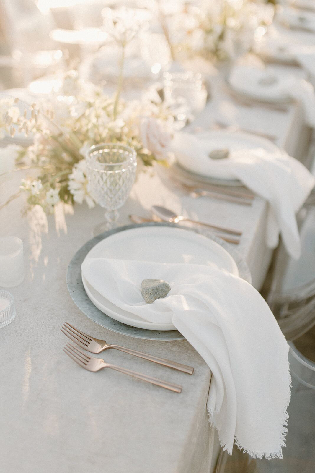 Gorgeous white on white wedding reception decor, captured by Nikki Collette, featured on the Brontë Bride Wedding Vendor Guide.