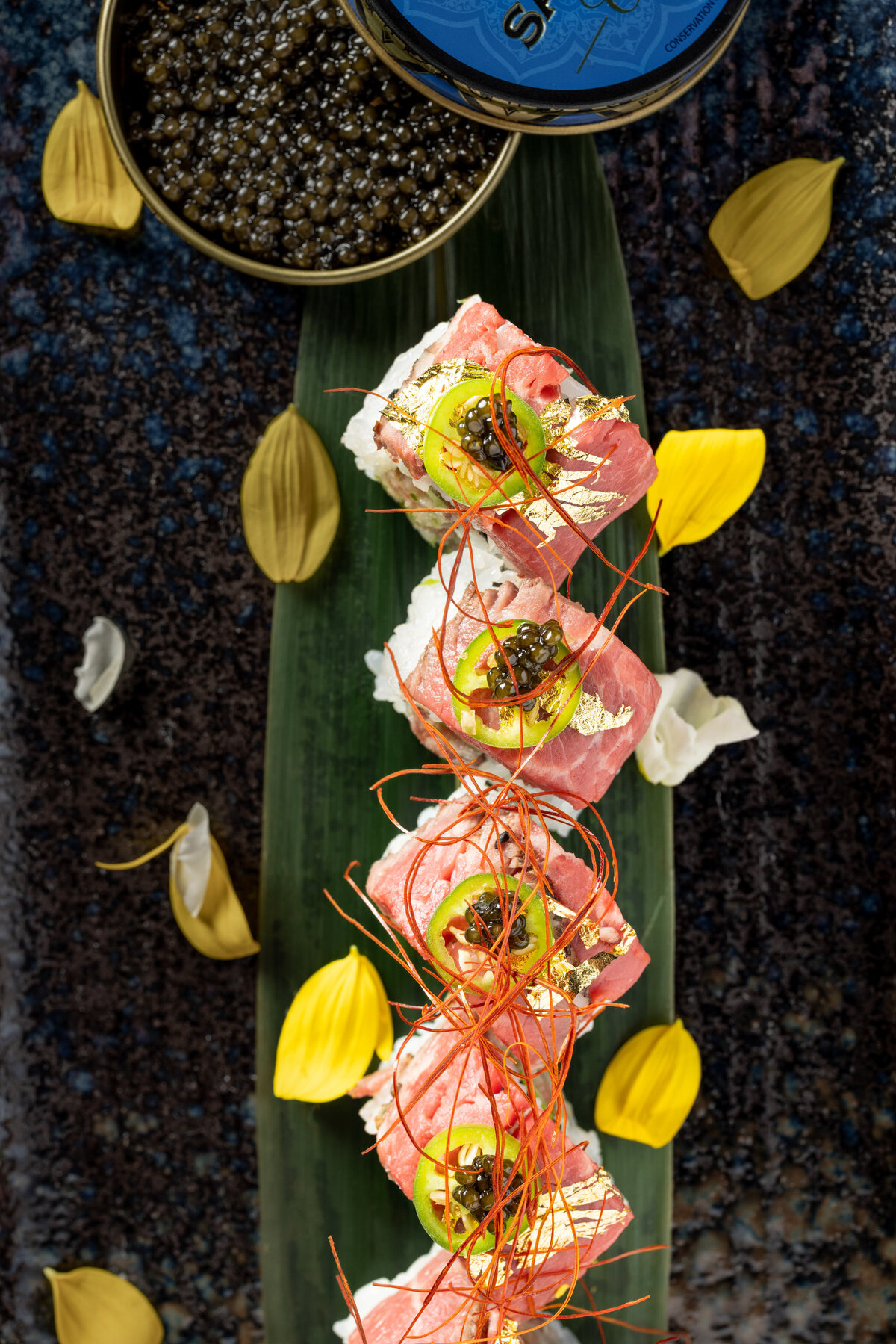 Sushi stacked on a leaf