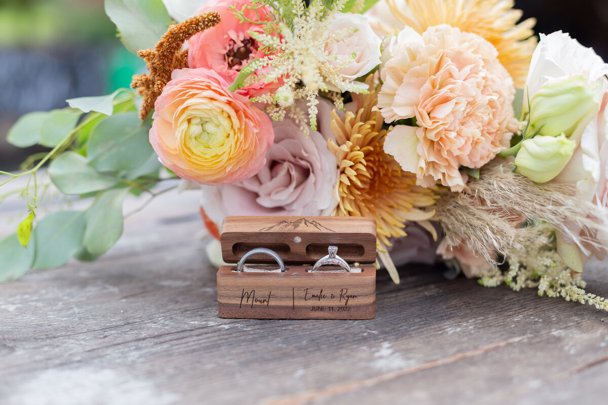 Washington Elopement Photographer captures bridal bouquet with wedding rings in front of it