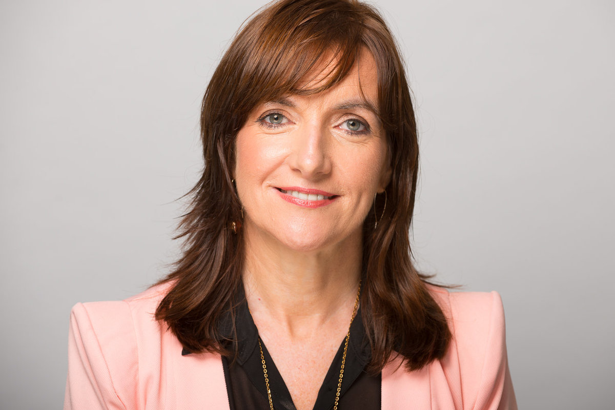 Colour profile pic of a woman for Linkedin wearing black shirt and suit jacket