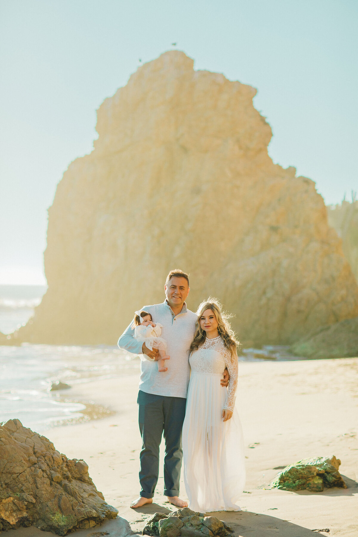 Family Portrait Photo Of Couple And Their Baby In White-themed Outfit Los Angeles