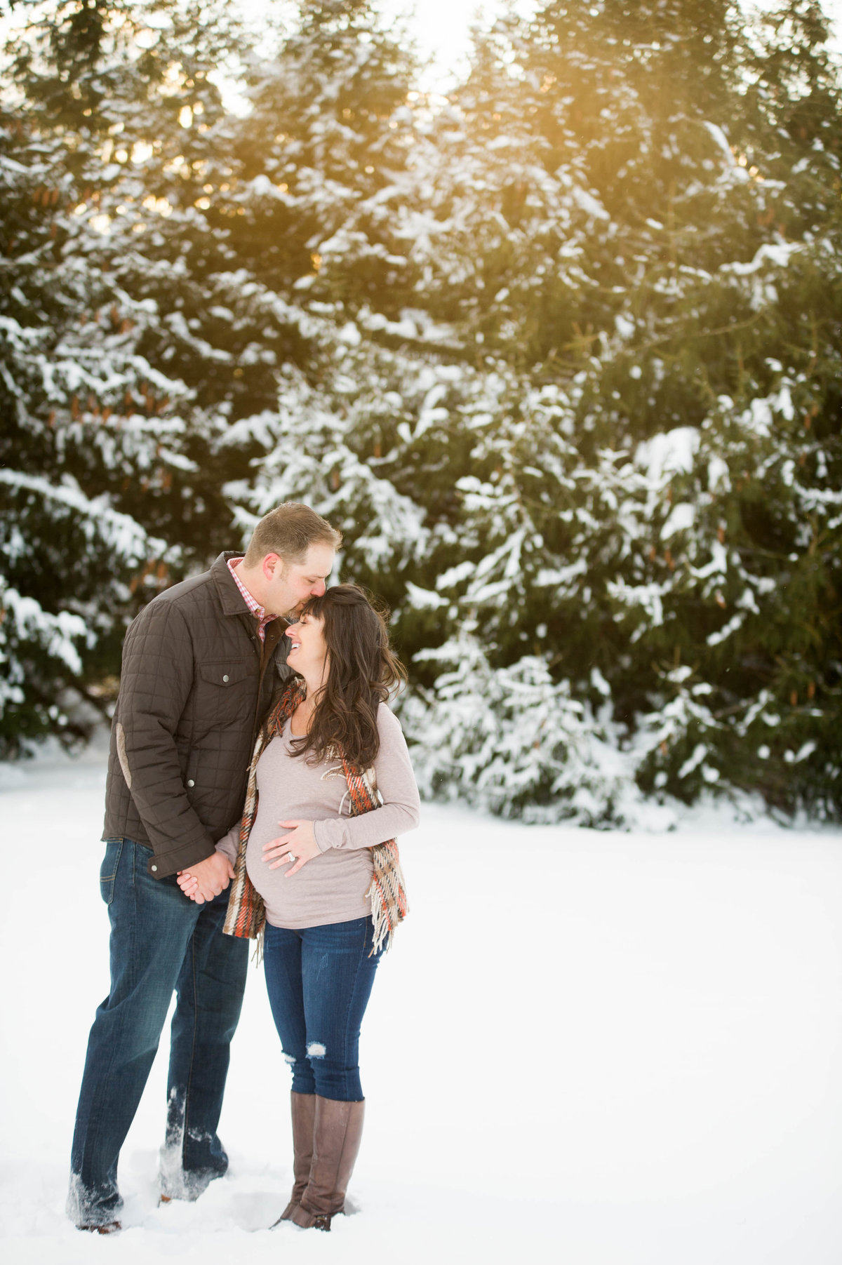 maternity photos with snowy trees