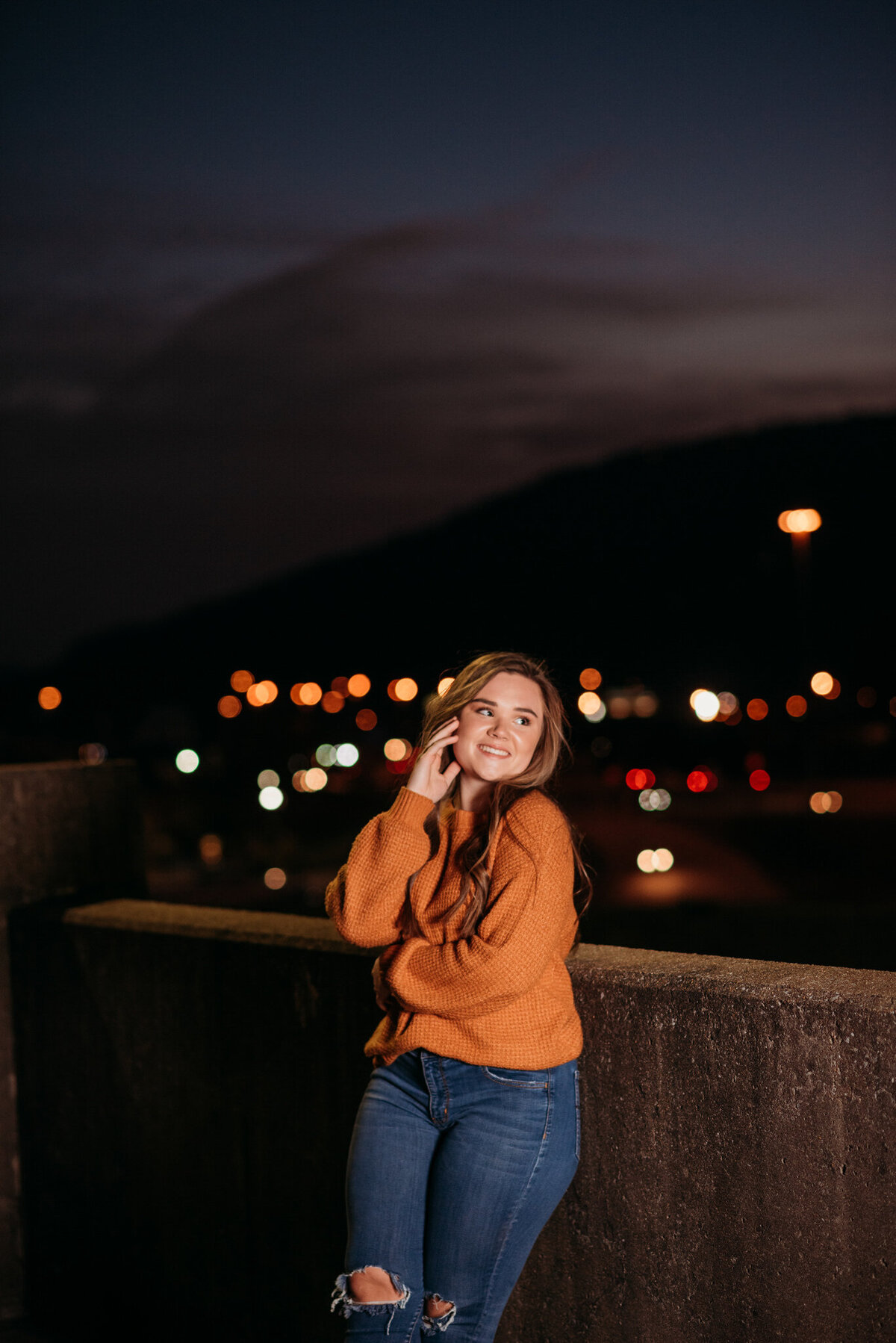 photo of girl on a parking garage at night