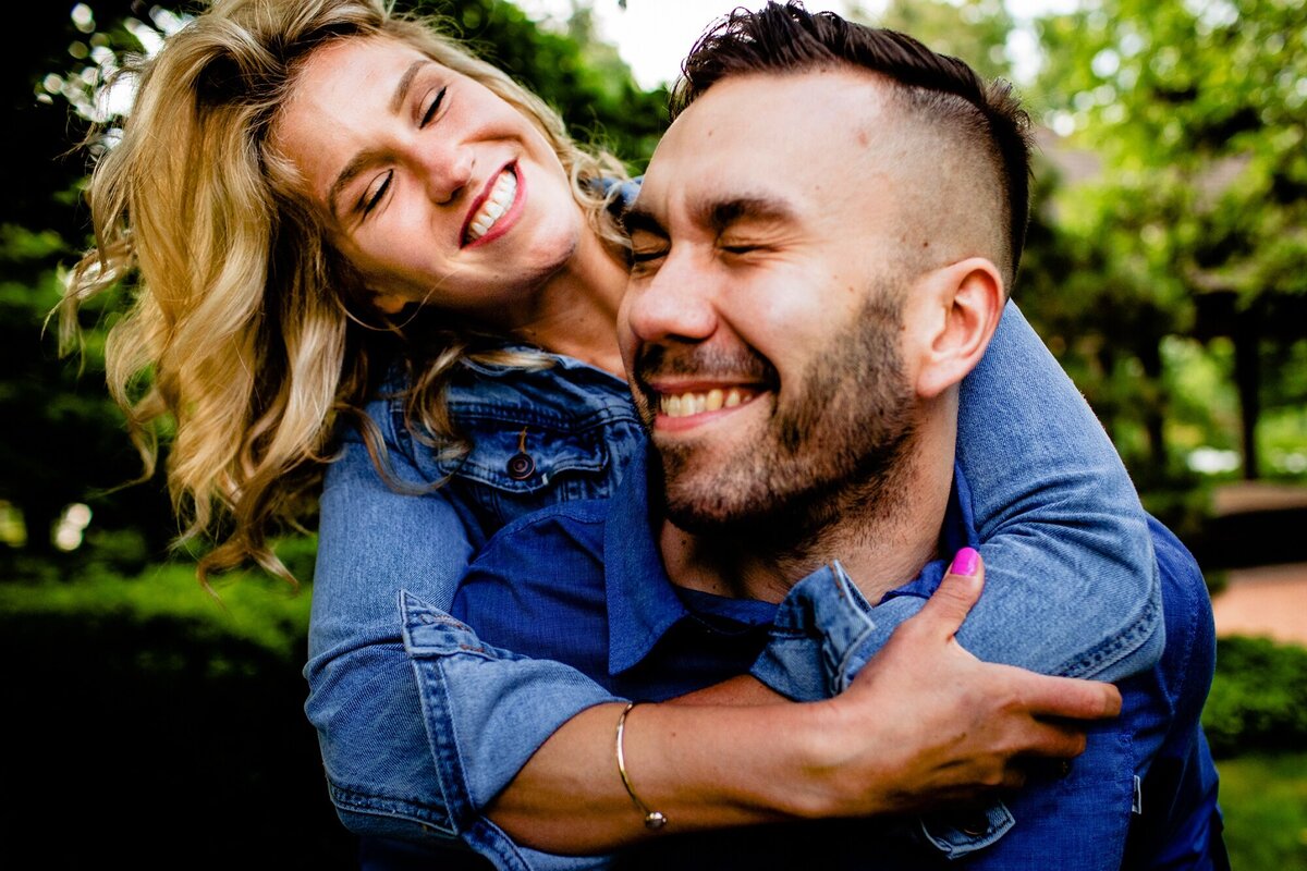 A couple laughs together during a Garden of the Phoenix engagement session.