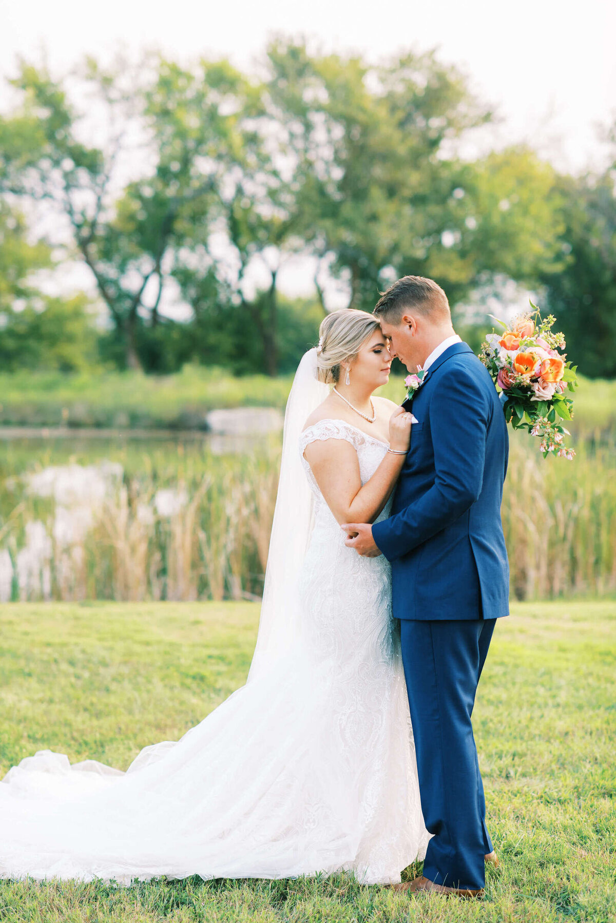 Newly married couple embraces at the Nest at Ruth Farms wedding venue