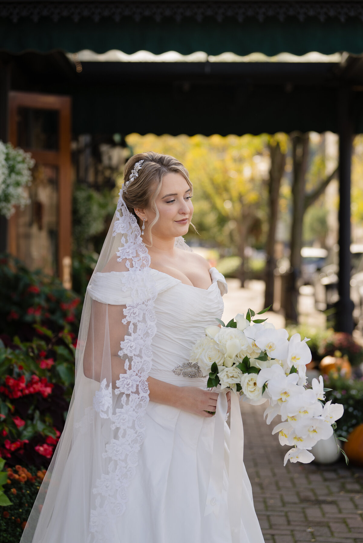 bride in outdoor spot holding flowers