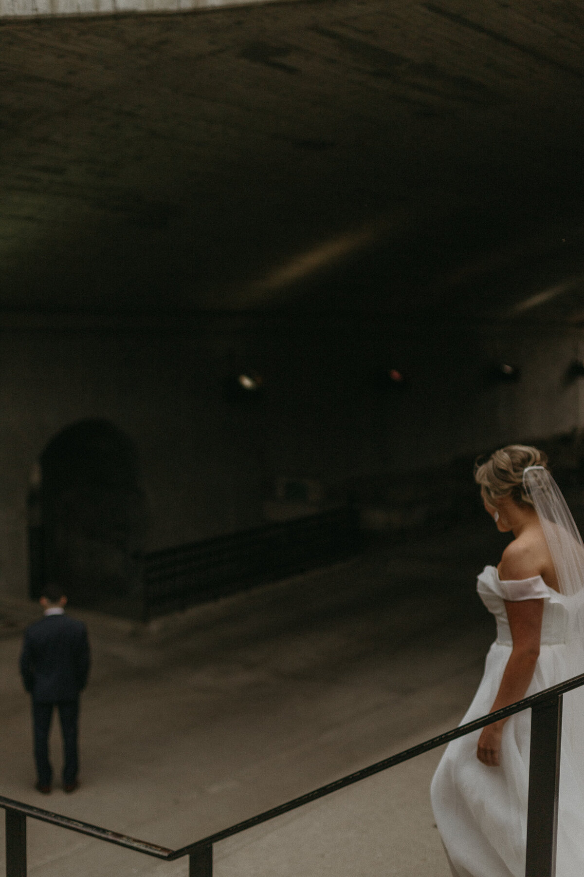 Bride and groom at first look photos under Chateau Laurier in downtown Ottawa Ontario