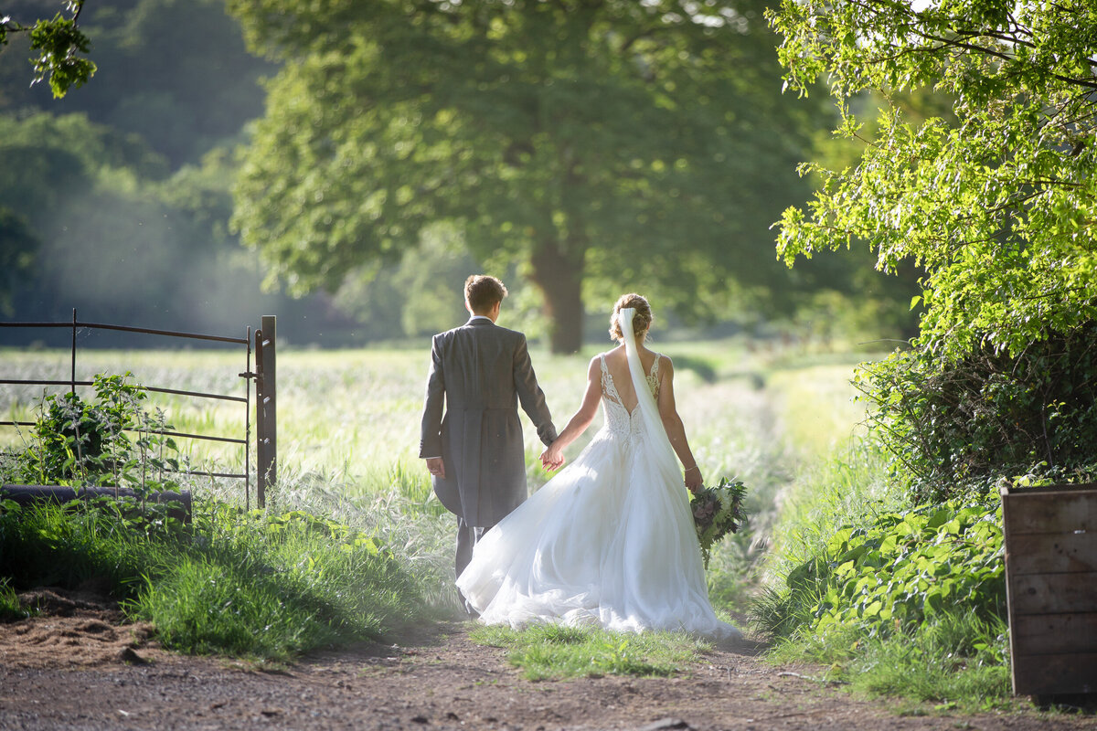 Bride and Groom walking at St Audries Park, Somerset