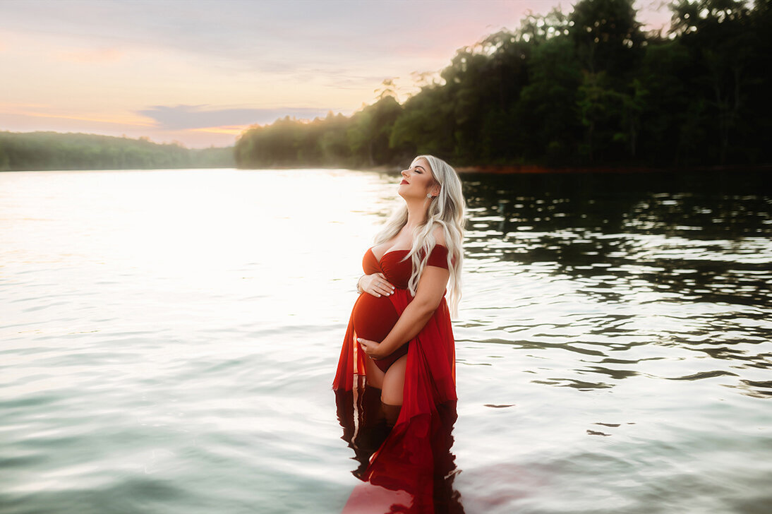 Pregnant woman poses for Maternity Photoshoot in a lake in Asheville, NC.