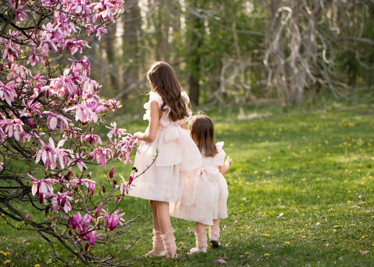 Girls Playing near Flowering Tree