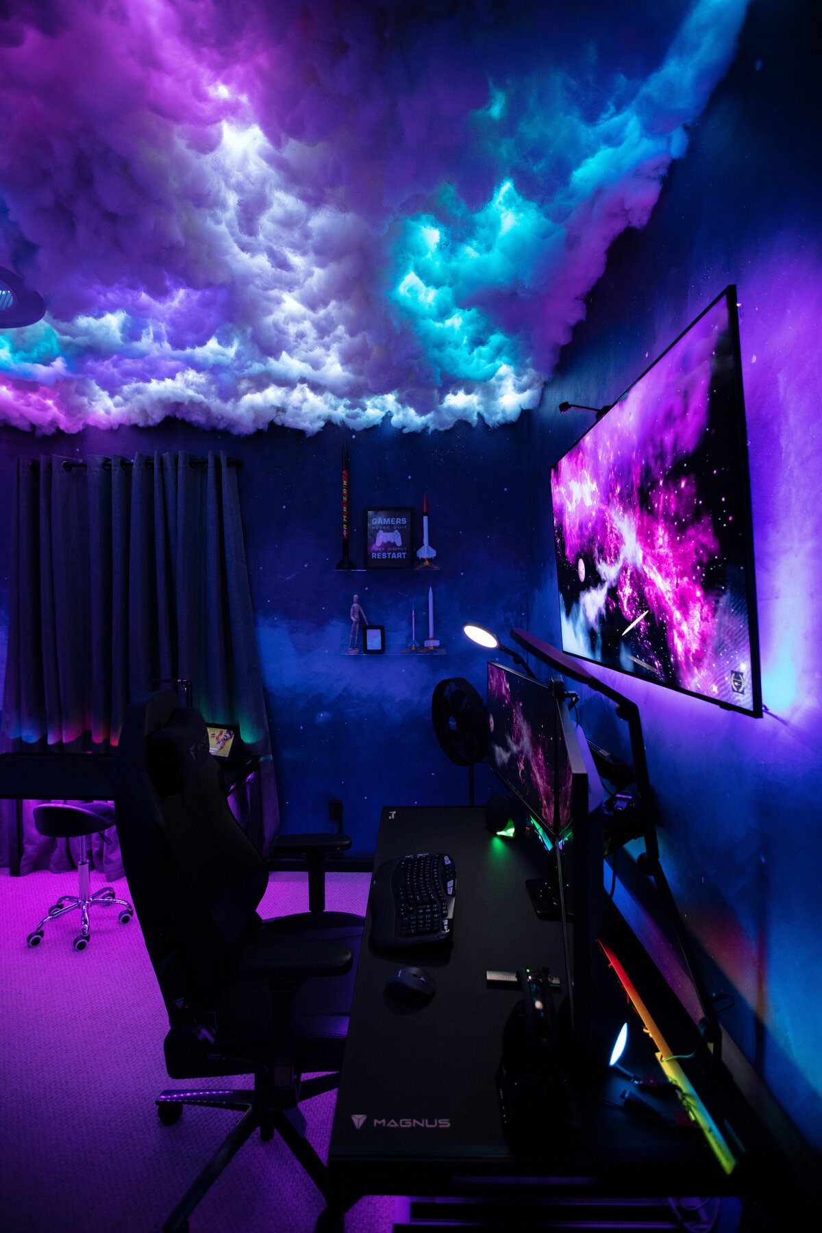 a black gaming station with rainbow and galaxy pattern accents