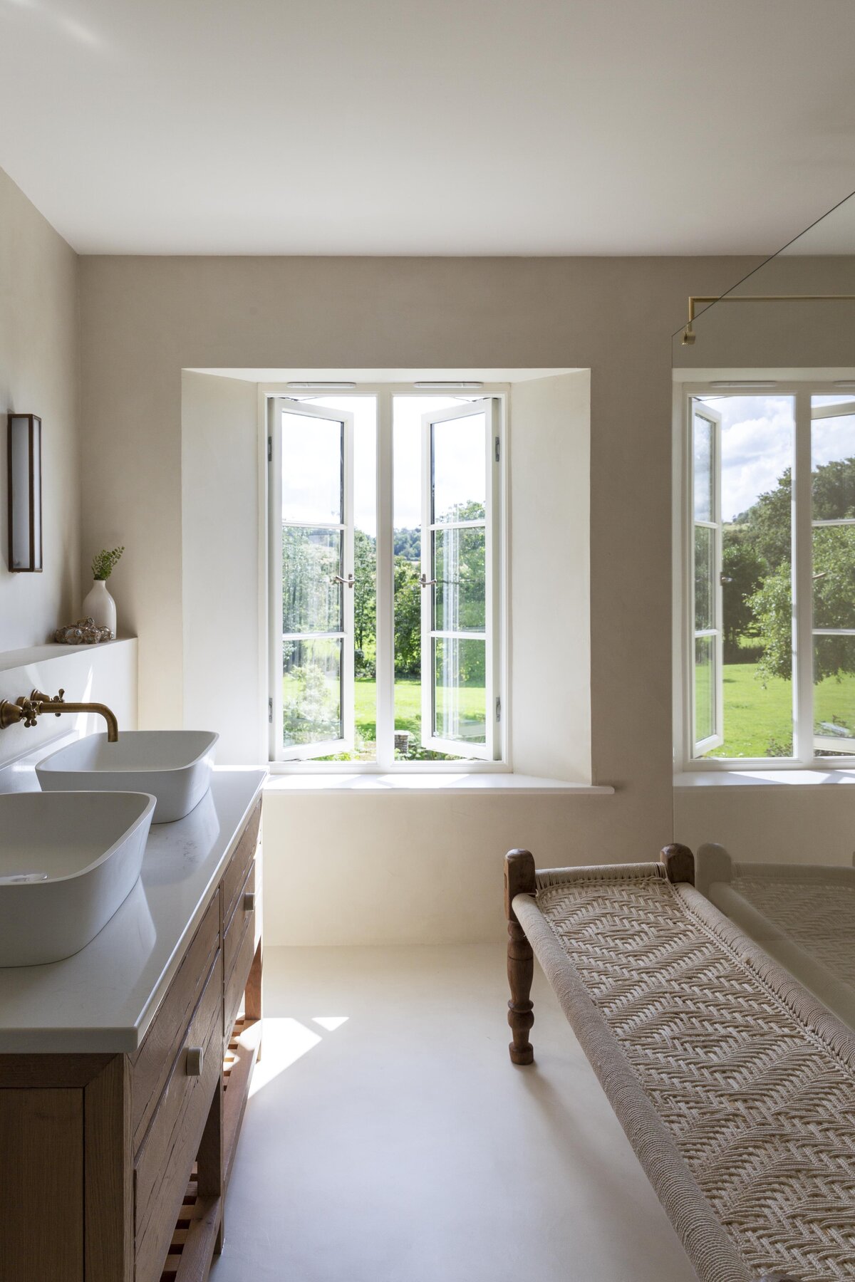 Master Bathroom with large shower, double sinks and a view to the countryside