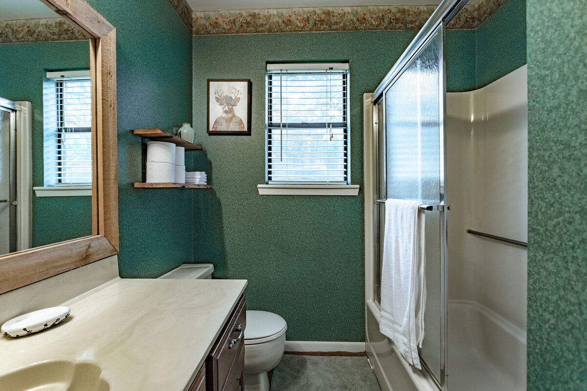 Bathroom with large vanity and shower in this three-bedroom, two-bathroom ranch house for 7 with incredible hiking, wildlife and views.