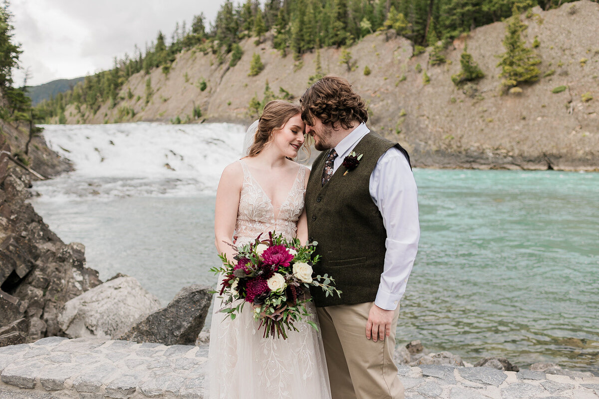 Elopement wedding photo on pebble beach in the mountains