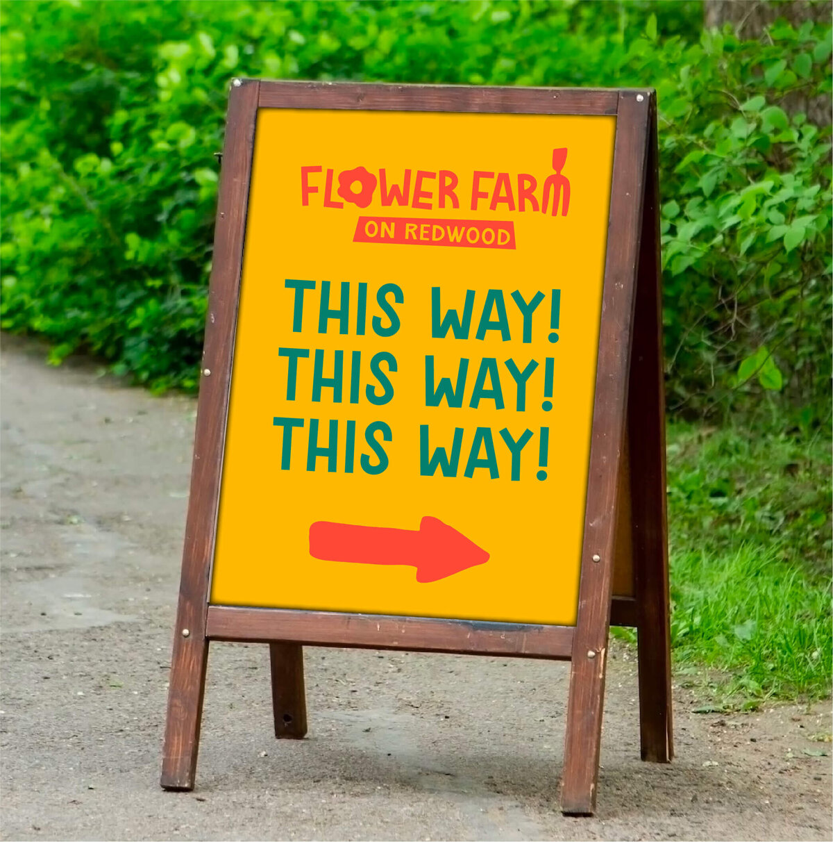 This way sign with arrow for flower farm on redwood