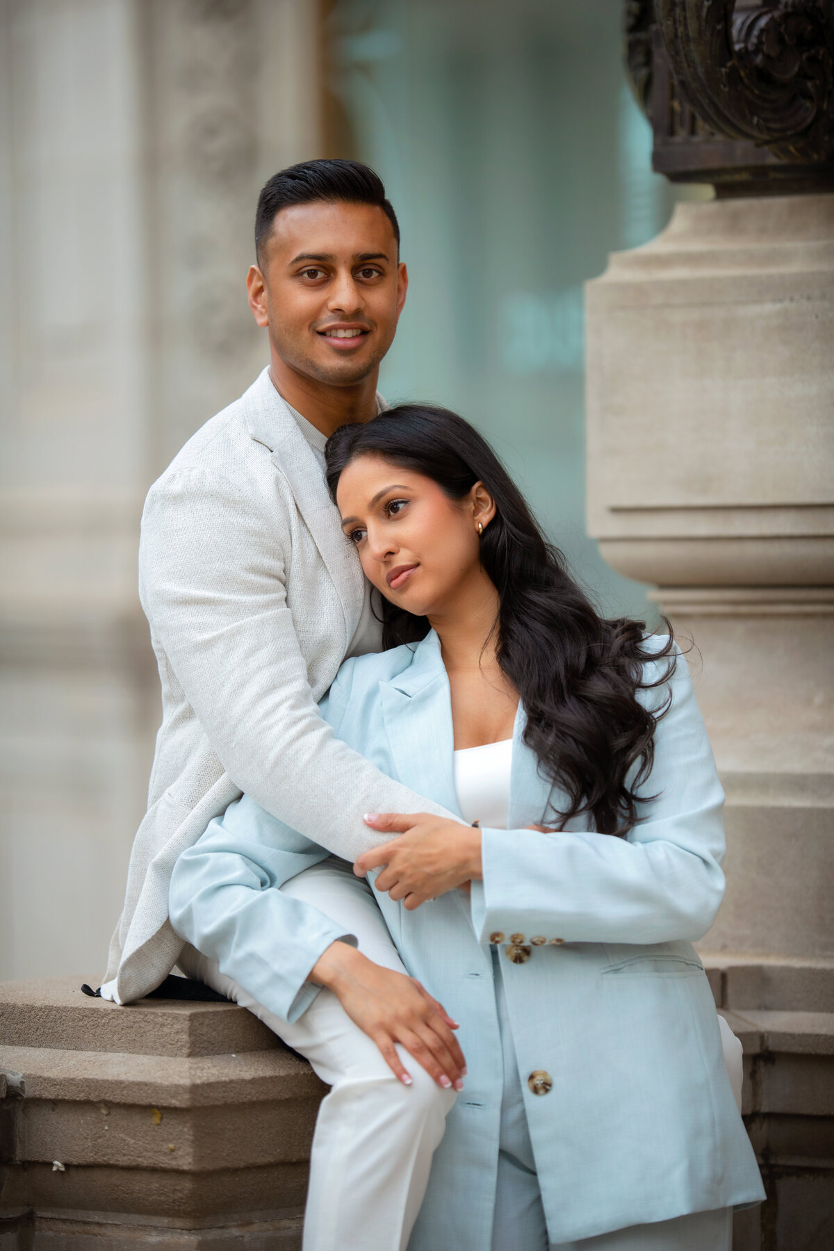 Stylish young couple pose in downtown Chicago during engagement photoshoot