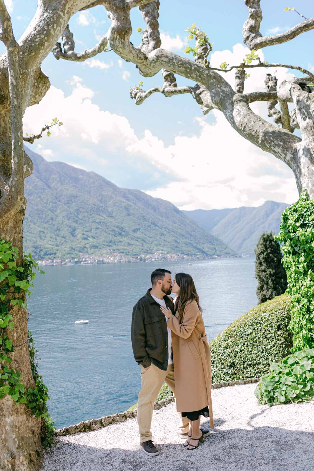 engaged couple's kiss at the Lake Como