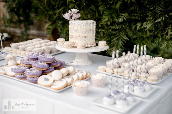 white and purple sweets table