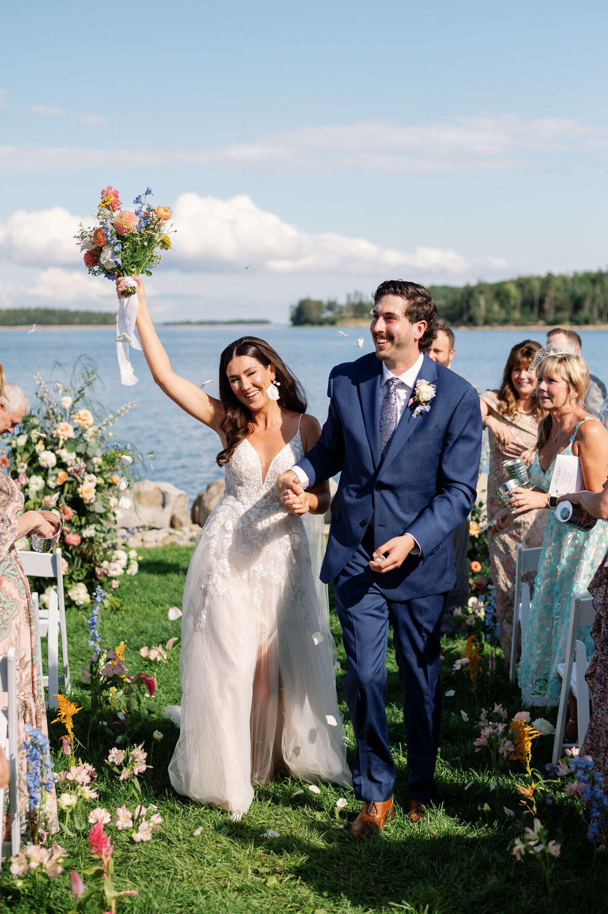Bride and groom walking back down the aisle after wedding ceremony at Oak Island Resort Wedding, Nova Scotia