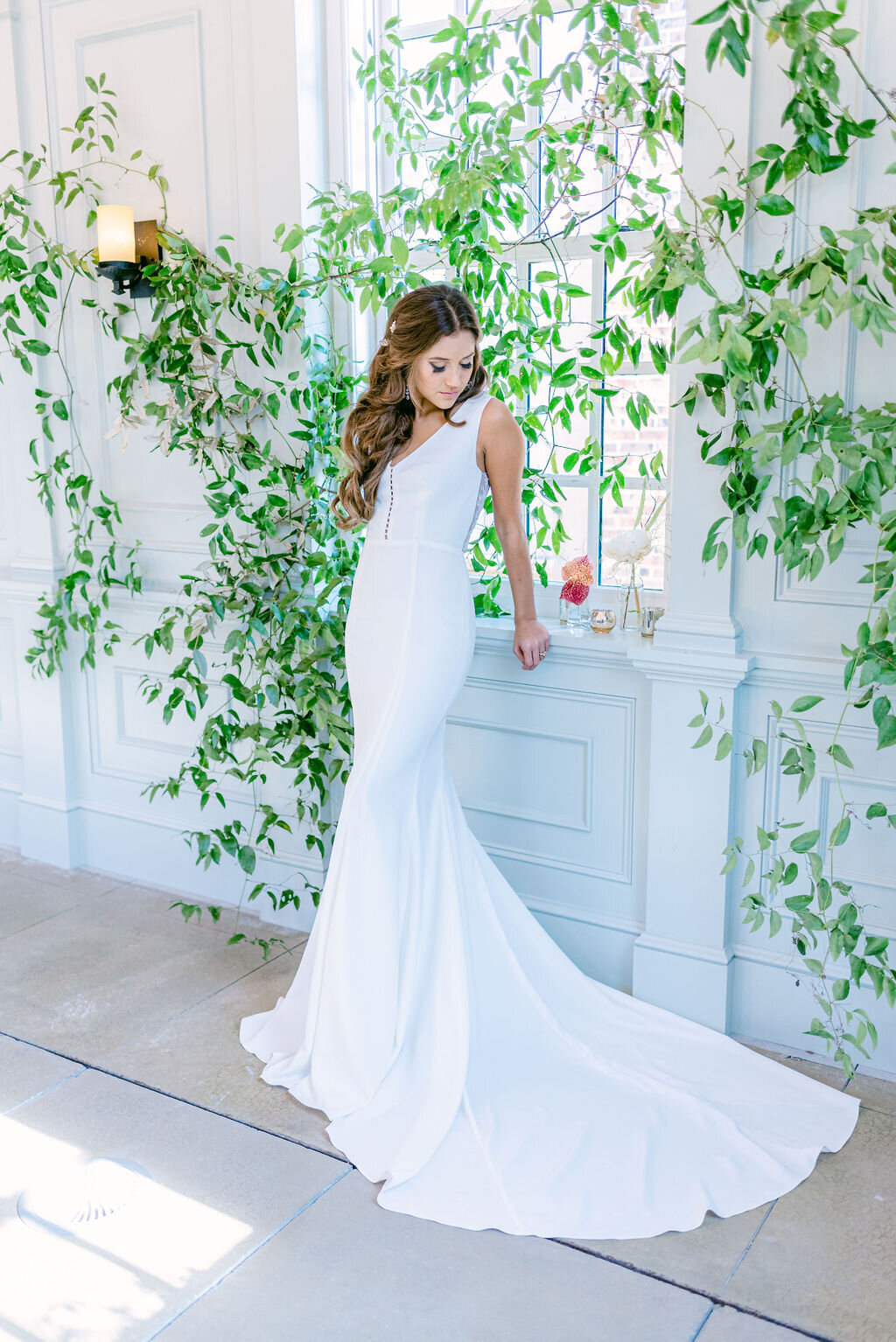 The Jane style is a timeless, crepe wedding gown with pearl accents by indie bridal designer Edith Elan.